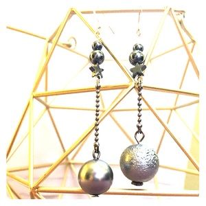 Asymmetrical planetary star dangle earrings